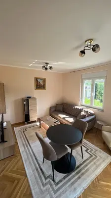 a living room with a couch and a table at Vrnjačka View apartments in Vrnjačka Banja