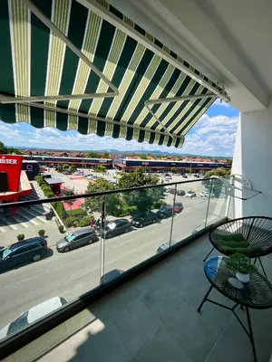 a balcony with a view of a parking lot at Kalamata apartman, K Kompleks Jagodina in Trnava