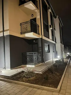 a building with two balconies on the side of it at Gudzic in Vrnjci