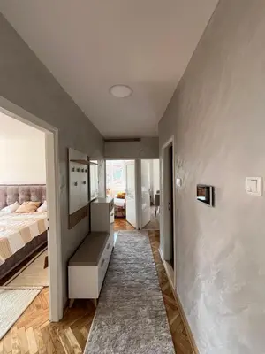 a living room with a bed and a couch at Kika in Prokuplje
