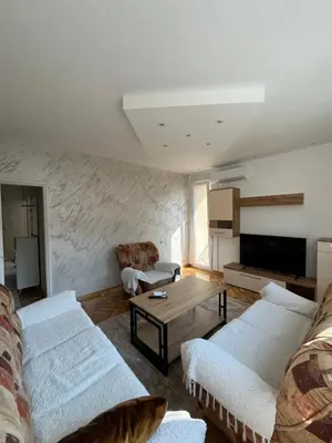 a living room with two couches and a coffee table at Kika in Prokuplje