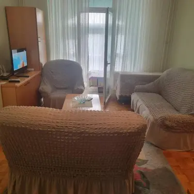 a living room with a couch and a table at Apartman Mina in Vrnjačka Banja