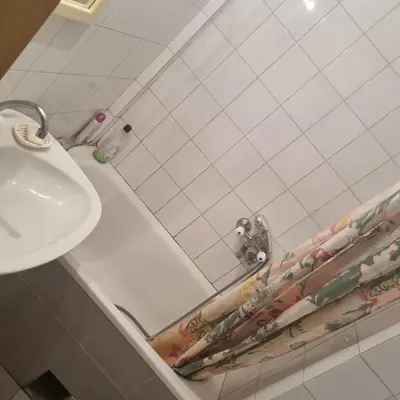 a bathroom with a sink and a bath tub at Apartman Mina in Vrnjačka Banja