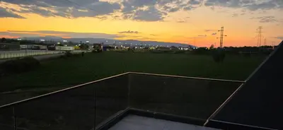 a view from the roof of a building at sunset at SEE YOU Apartments in Niš