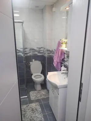 a bathroom with a toilet and a sink at Banjski kutak in Vrnjačka Banja