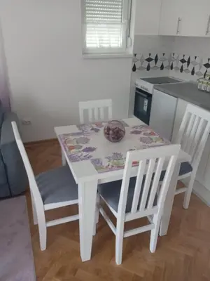 a white table and chairs in a kitchen at Banjski kutak in Vrnjačka Banja