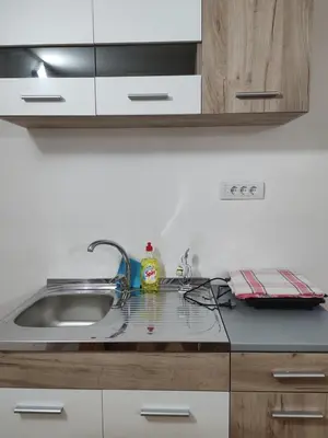 a kitchen counter top with a sink and a sink at Apartmani Pegasus in Vranje