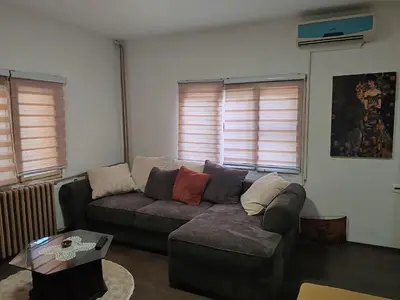 a living room with a couch and a table at Apartmani Pegasus in Vranje