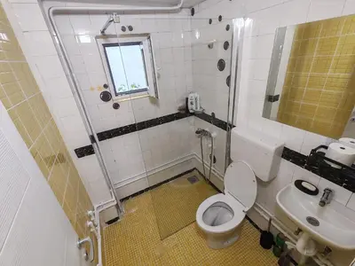 a bathroom with a toilet and a sink at Apartmani Pegasus in Vranje