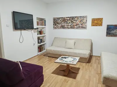 a living room with a couch and a coffee table at Apartmani Pegasus in Vranje