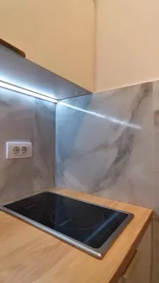 a kitchen with a counter with a plastic cover on it at Apartman Taris in Vrnjačka Banja