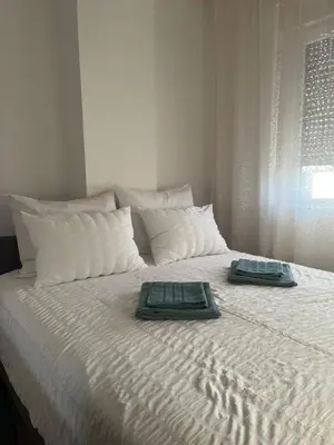a bed with two towels on top of it at IL Paradiso potok akva park in Jagodina