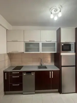 a kitchen with a sink and a microwave at IL Paradiso potok akva park in Jagodina
