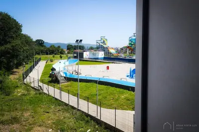 a view of a water park from a window at Aqua Vista Lux Raj in Vrnjačka Banja