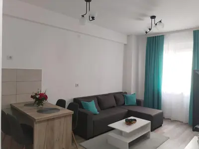 a living room with a couch and a table at Apartman Simijonovic in Trnava