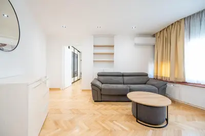 a living room with a couch and a table at Apartman Simonovic in Vrnjačka Banja
