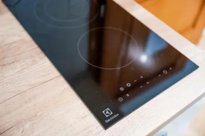 a tablet computer sitting on top of a wooden table at Apartman Simonovic in Vrnjačka Banja