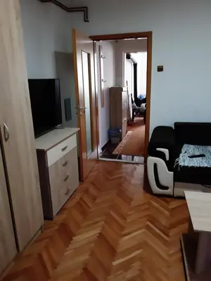 a living room with a couch and a television at Anika in Soko Banja