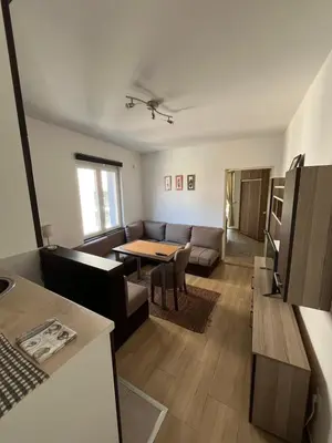 a living room with a couch and a table at Na Banjici in Soko Banja
