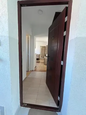 a door to a hallway with a mirror in it at Na Banjici in Soko Banja