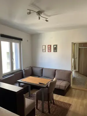 a living room with a couch and a table at Na Banjici in Soko Banja