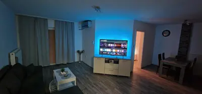 a living room with a flat screen tv in a room at Luxury apartment in the city center in Zaječar