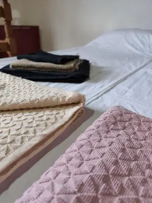 a pair of mattresses sitting on a bed at Vikendica Nina in Bor