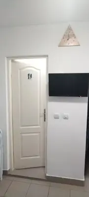 a room with a white door and a white cabinet at Sobe Paunović in Soko Banja