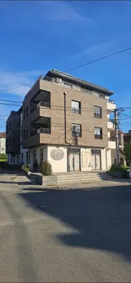 a large brick building on the side of a street at Sanela's Peace in Vrnjačka Banja