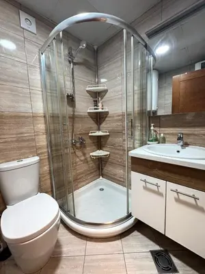 a bathroom with a shower and a toilet and a sink at Vrnjacki kutak in Vrnjačka Banja
