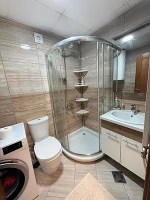 a bathroom with a shower and a toilet and a sink at Vrnjacki kutak in Vrnjačka Banja