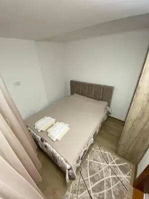 a small bedroom with a bed in a room at Apartman Porodična priča in Vrnjačka Banja