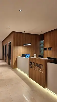 a store lobby with a sign that reads shared reference at Luna Residence in Niš
