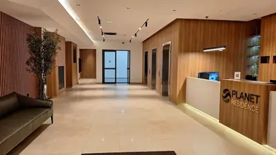 a hallway of a building with amarket resistance sign on the wall at Luna Residence in Niš