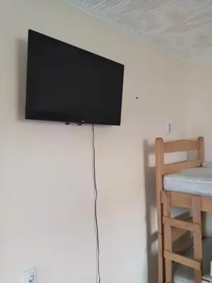 a flat screen tv hanging on a wall at Čardak Zaječar in Zaječar