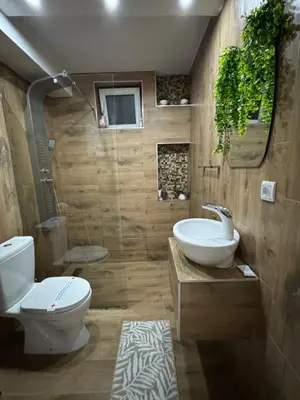 a bathroom with a toilet and a sink at SpaNish apartman 5 in Niš