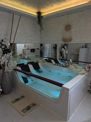 a bath tub in a room with at SpaNish apartman 5 in Niš