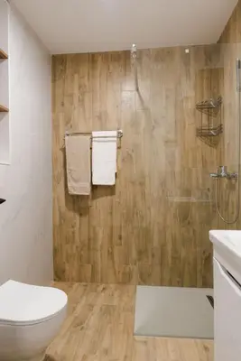 a bathroom with a toilet and a shower at Dina LUX apartman in Vrnjačka Banja