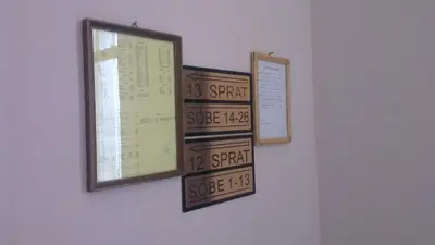 a window with a bunch of signs on a wall at Hotel Konaciste Trstenik in Trstenik