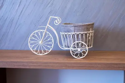 a figurine of a shopping cart on a shelf at Apartman A PLUS in Vranje
