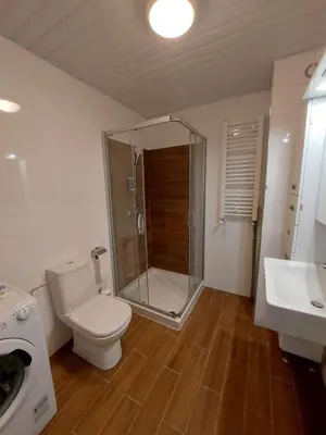 a bathroom with a toilet and a shower and a sink at Apartmani Katnic in Jagodina