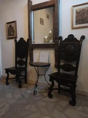 two chairs and a mirror in a room at Dvorac Castelo DB 2022 in Vrnjačka Banja