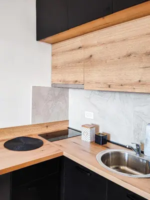 a kitchen with a sink and a wooden counter top at Kopaonik,President kop app 404 in Kopaonik