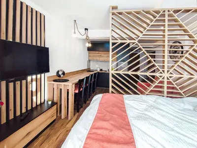 a bedroom with a bed and a desk at Kopaonik,President kop app 404 in Kopaonik