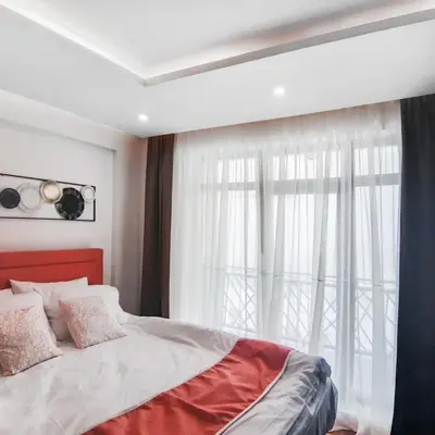 a bedroom with a large bed with a window at Kopaonik,President kop app 404 in Kopaonik