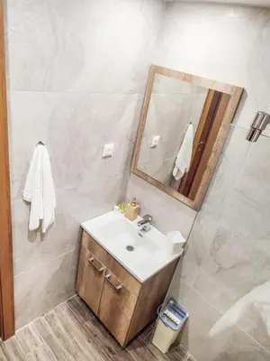 a bathroom with a sink and a mirror at Kopaonik,President kop app 404 in Kopaonik