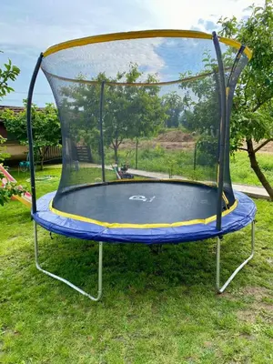 a trampoline on the grass in a yard at Philippos in Bujanovac