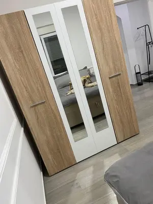 a sliding door with a dog laying on a bed at LoKA apartman in Paraćin