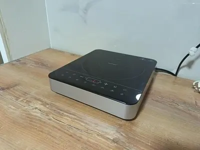 a electronic device sitting on top of a wooden table at Eva Apartman in Prokuplje