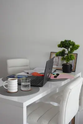 a desk with a laptop computer on top of it at Niš Deluxe in Niš